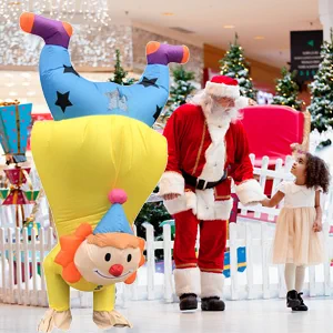 Inflatable clown costume in shopping mall with Santa